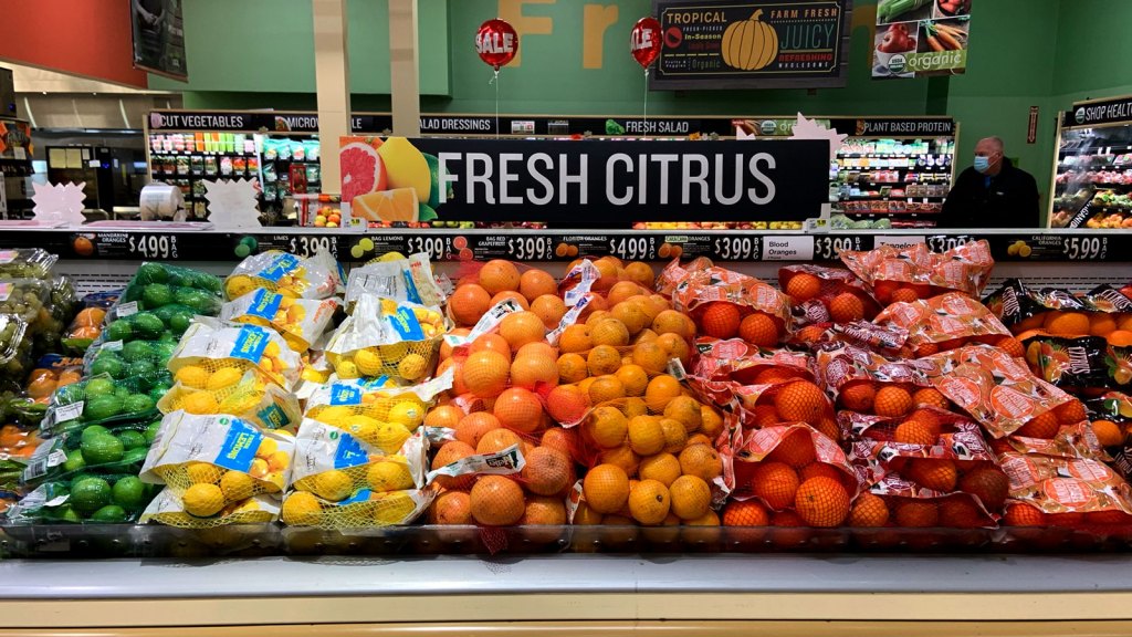 Fruit bagged in plastic netting at grocery store