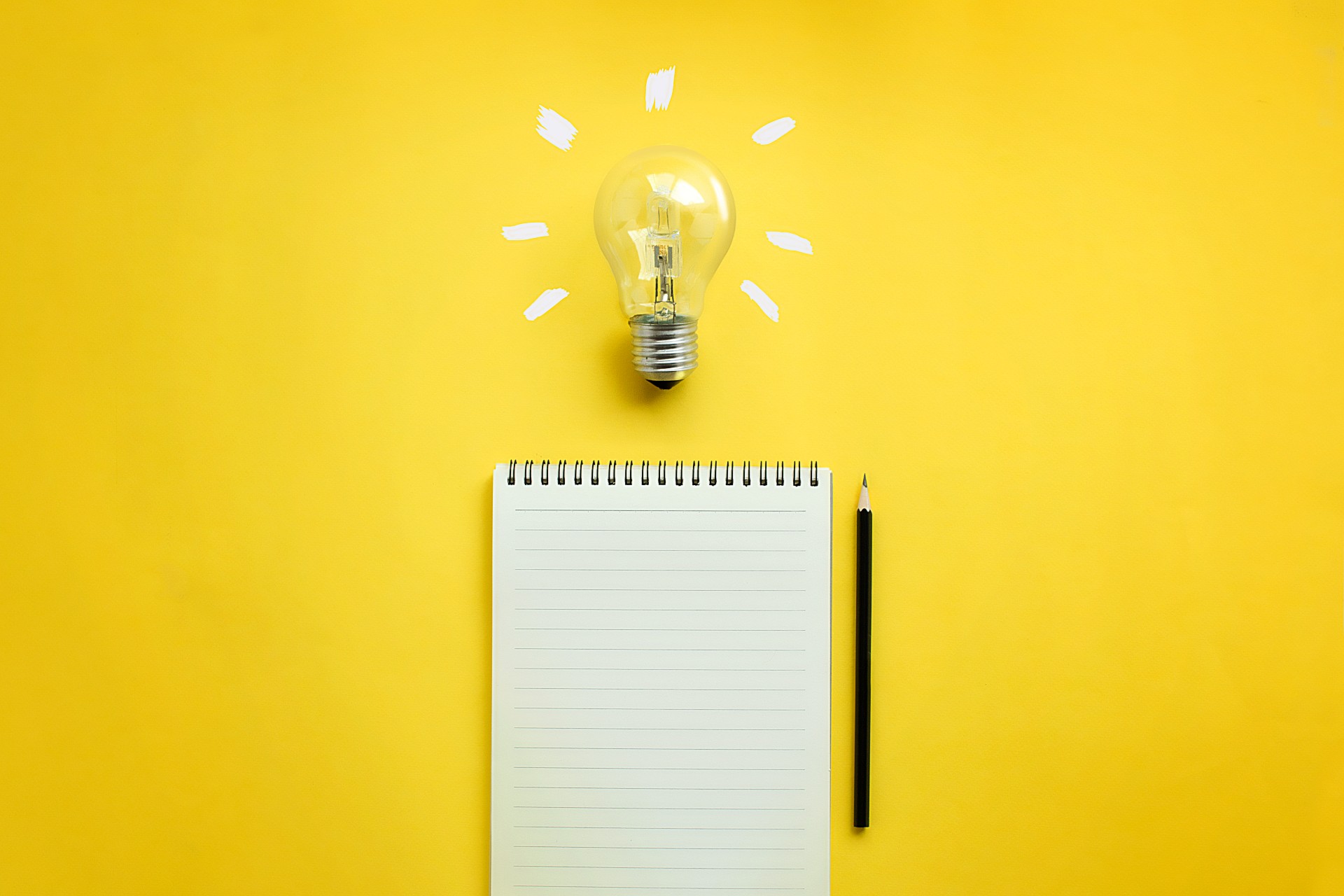 Light bulb and notepad