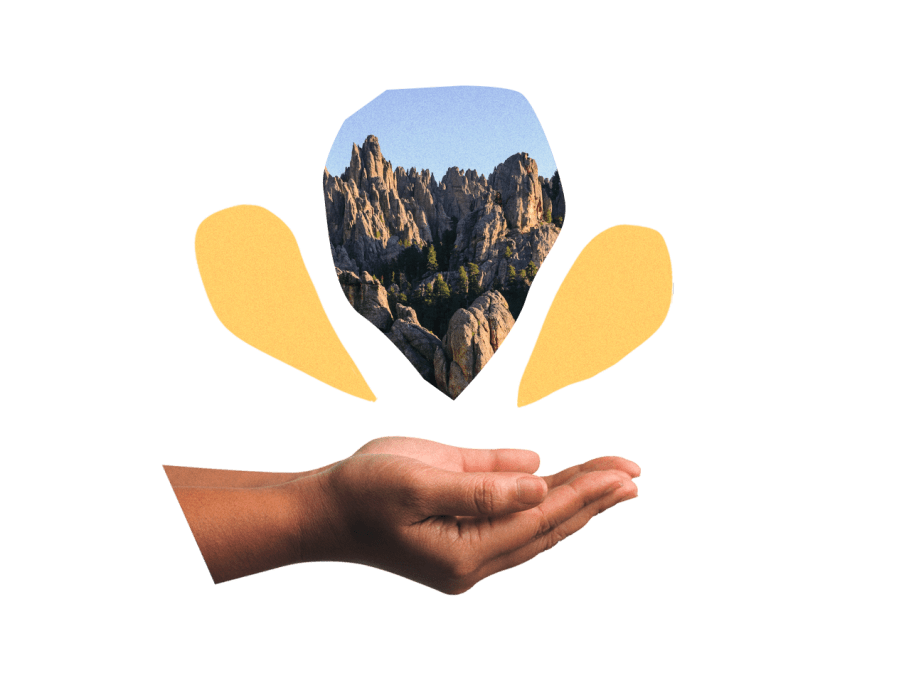 Hands cupped below an image of the Black Hills