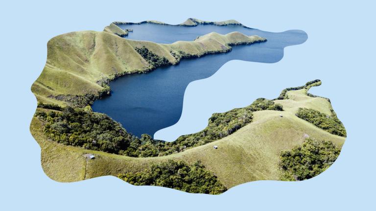 Aerial view of Sentani Lake in Jayapura, Indonesia, cut out and placed on a light blue background