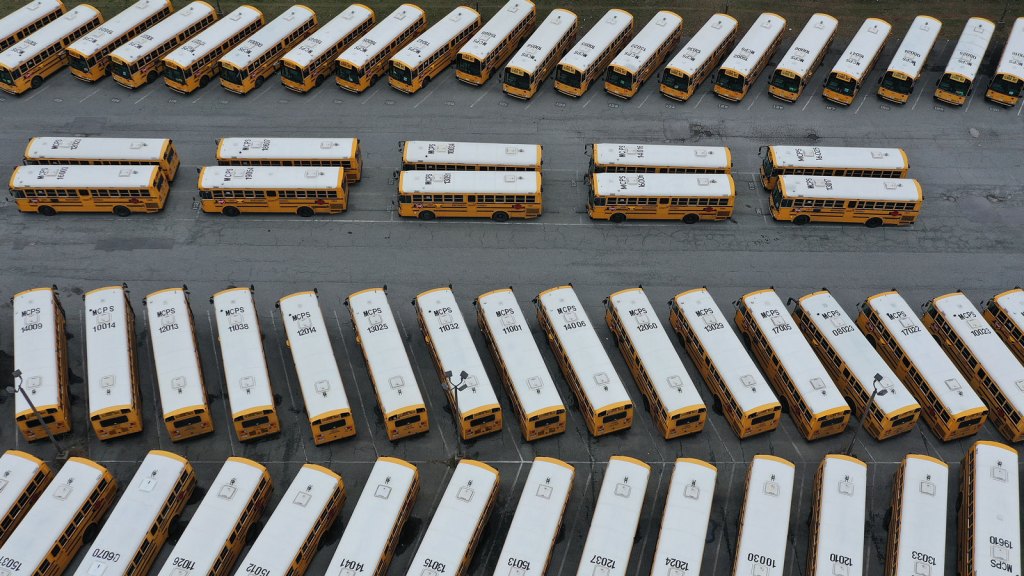 Rows of school buses parked at the Montgomery County Schools Clarksburg Bus Depot