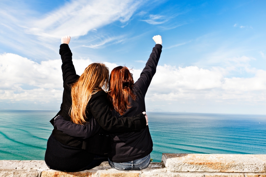 women with fists raised