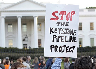 Keystone protest sign in front of White House