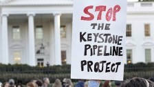 Keystone protest sign in front of White House