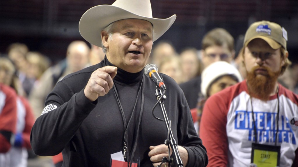 speaker in cowboy hat at hearing