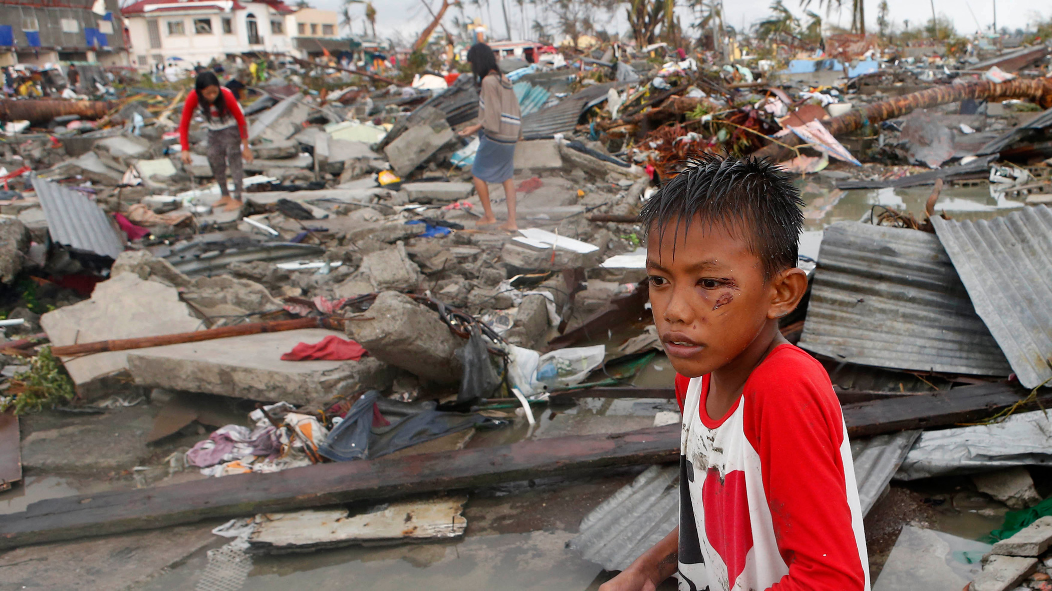 boy at scene of devastation from Typhoon Haiyan