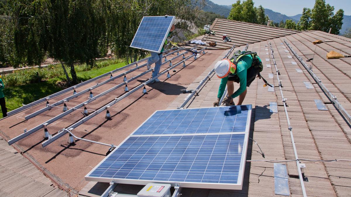 solar panels going up on a roof