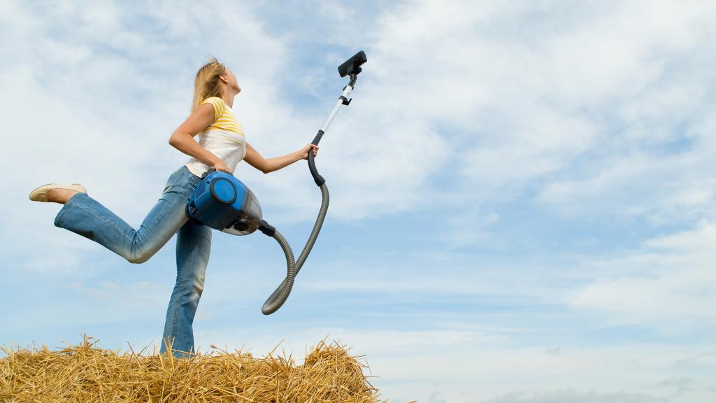 woman vacuuming sky