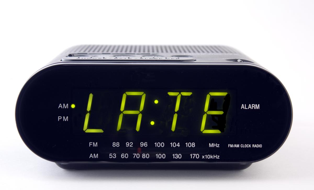 alarm clock that says "late"