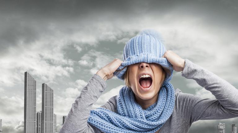 screaming young woman in front of polluted city