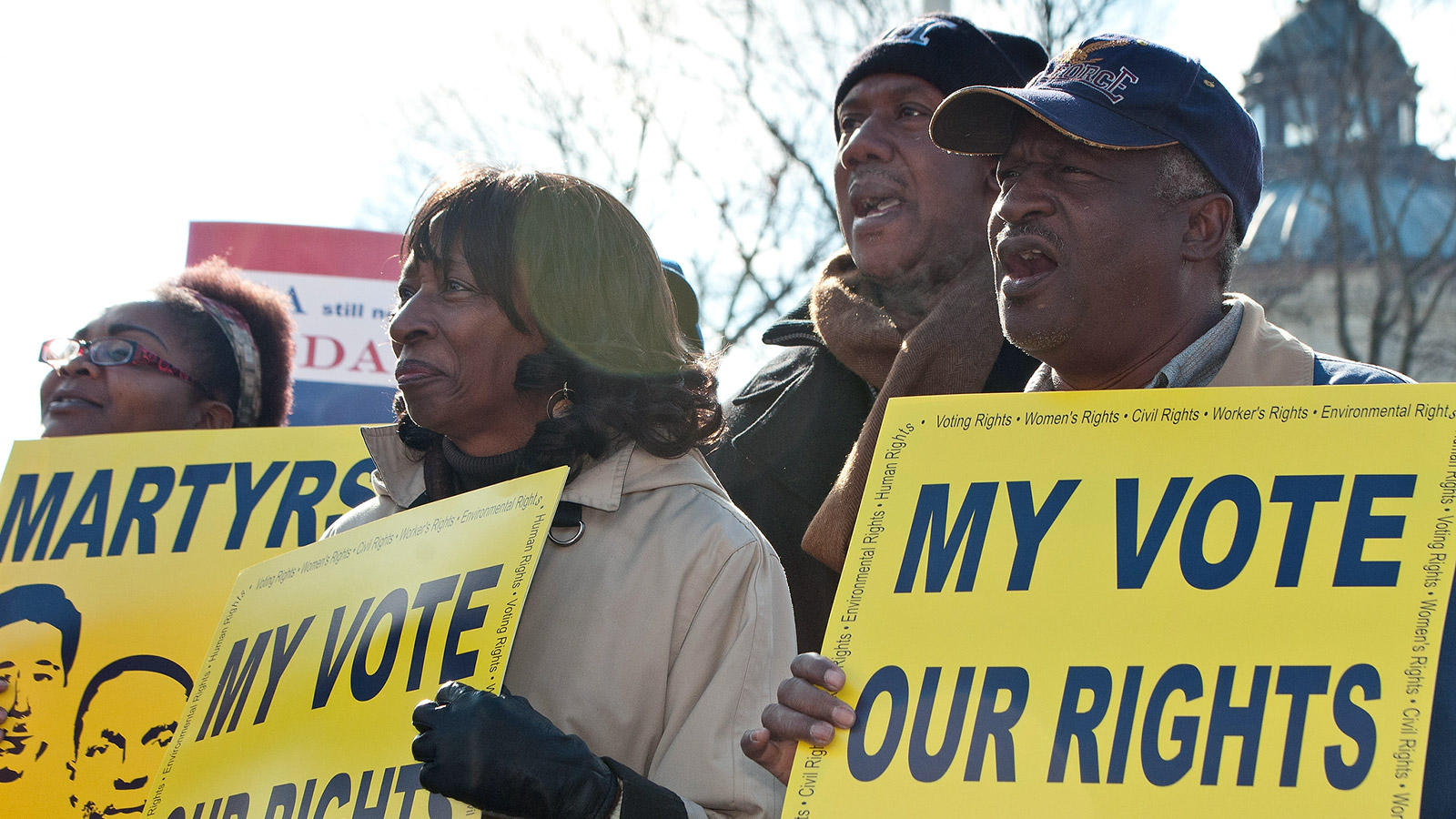 voting rights activists with signs