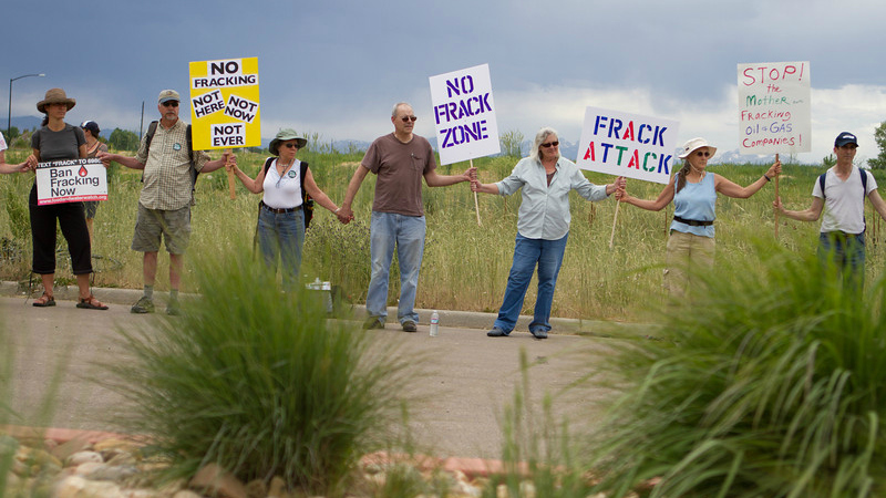 fracking protestors holding hands