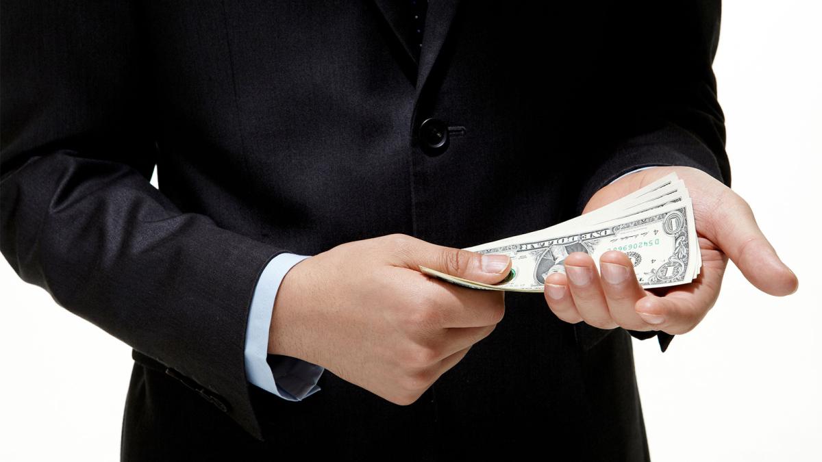 Businessman with bribe money