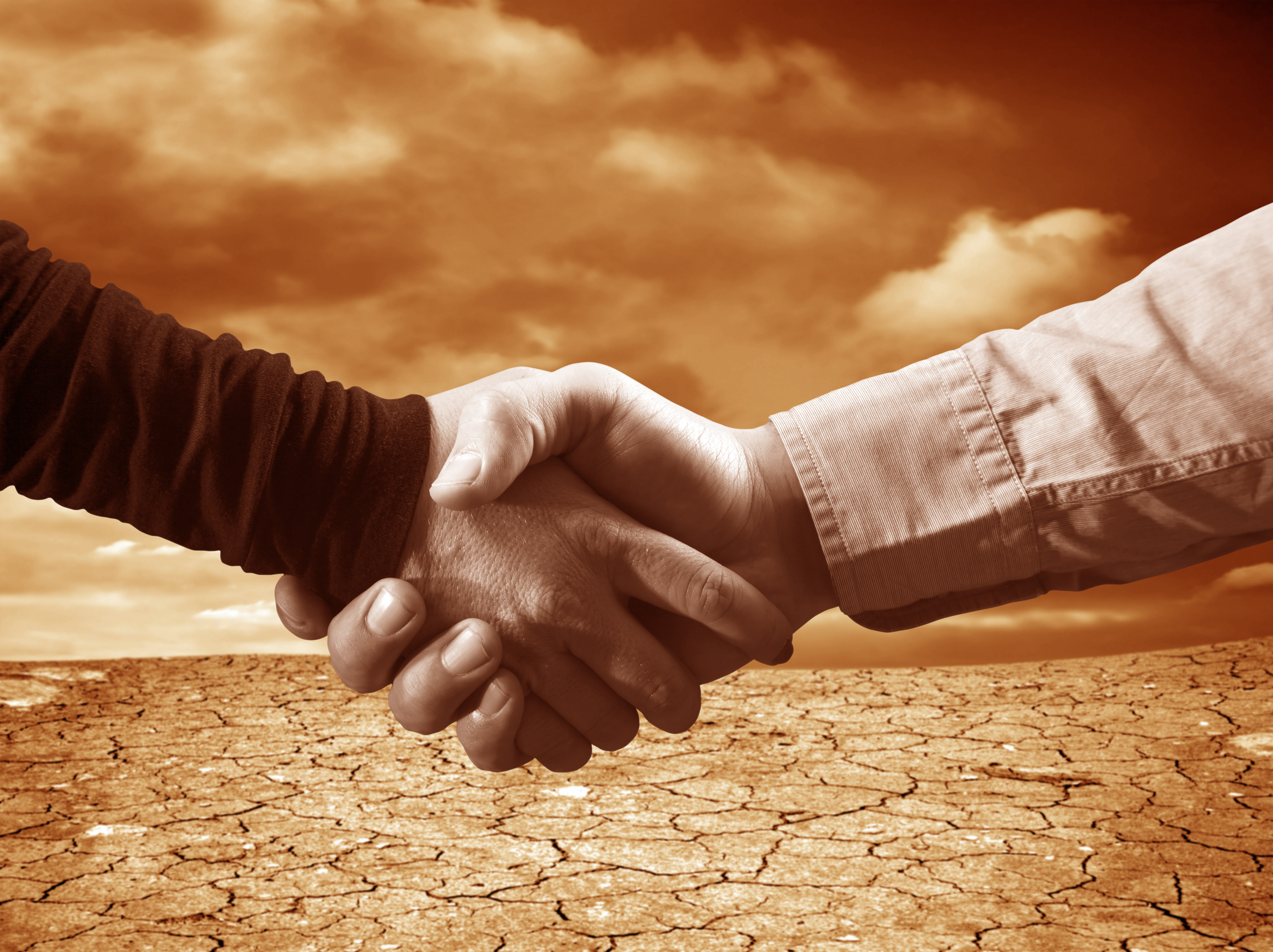 Handshake agreement negotiations desert sepia