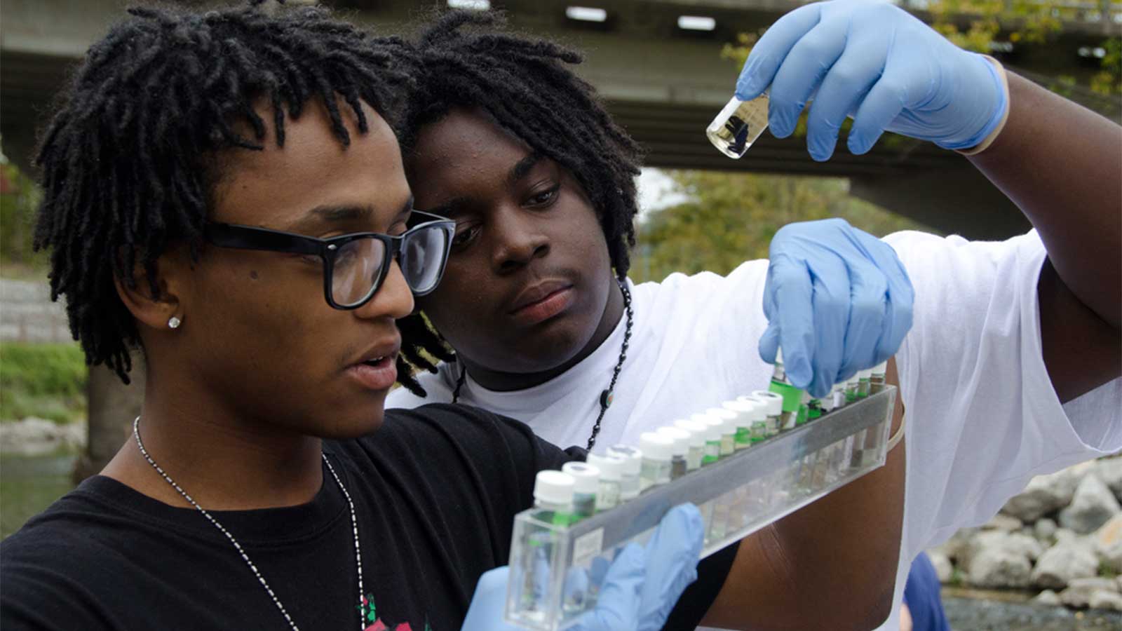 High school students help with water monitoring and river cleanup