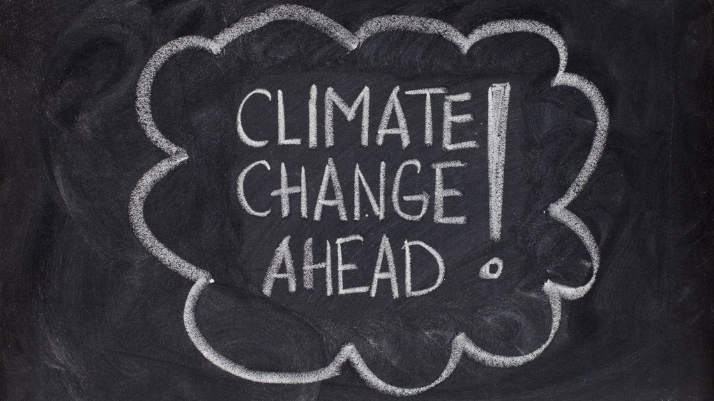 chalkboard writing: "Climate change ahead!"