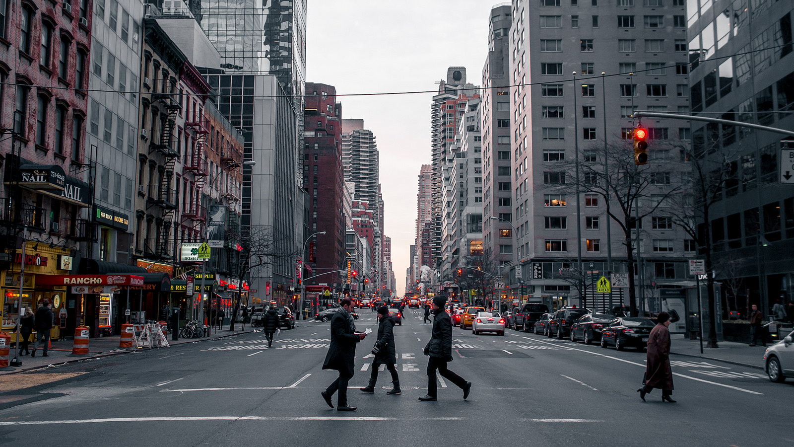 Pedestrians crossing street in New York City
