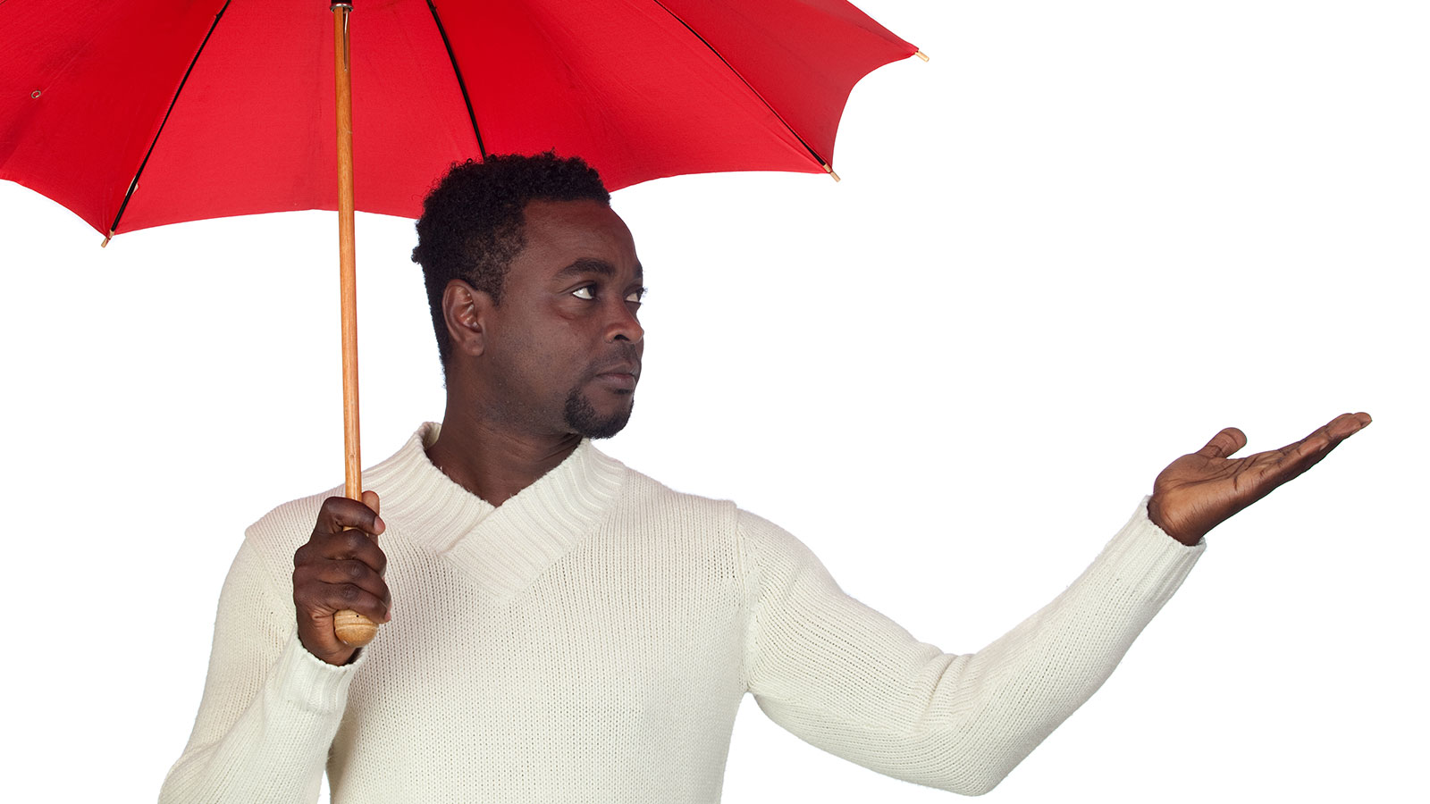 Man under umbrella, uncertain about rain