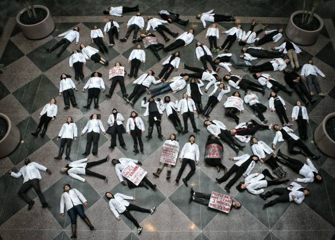 Harvard Medical School students stage a die-in. 