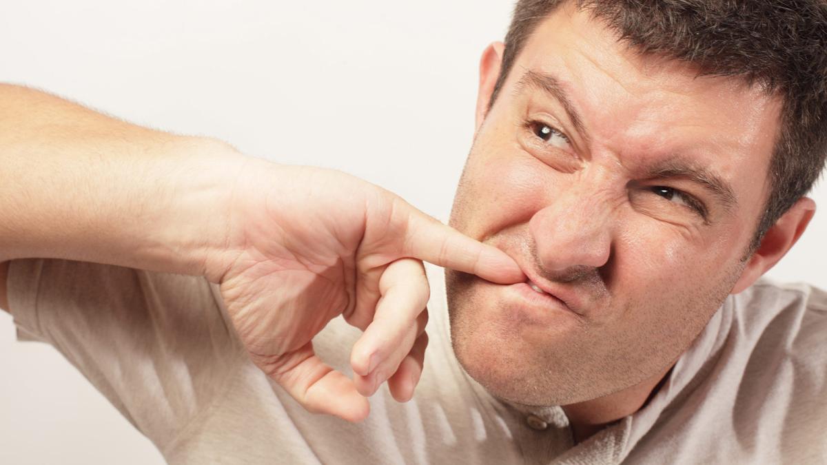 Man picking teeth