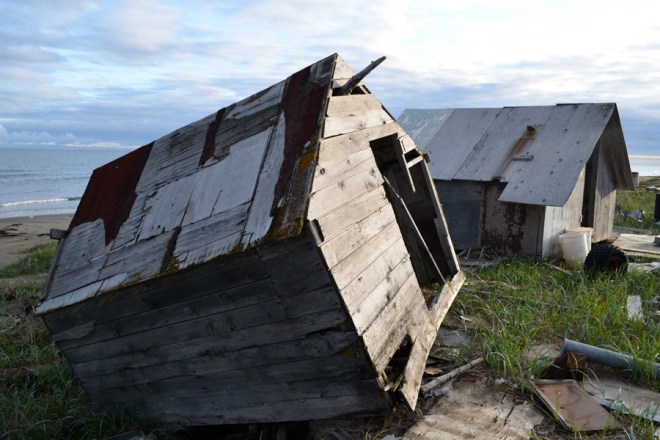 It's obvious that something is wrong in Shishmaref. One of the first things you see as you arrive is a small wooden building propped precariously on the edge of the beach.
