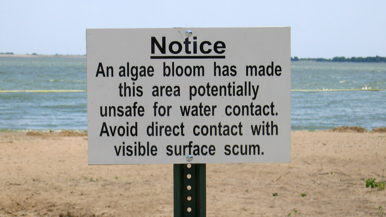 Warning sign in a beach on Lake Marion, Kansas.