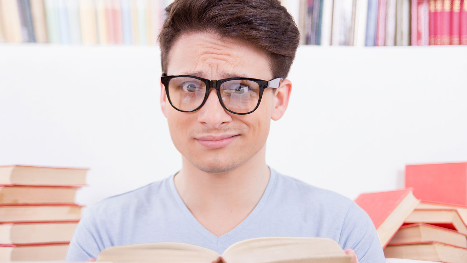 Confused student with books