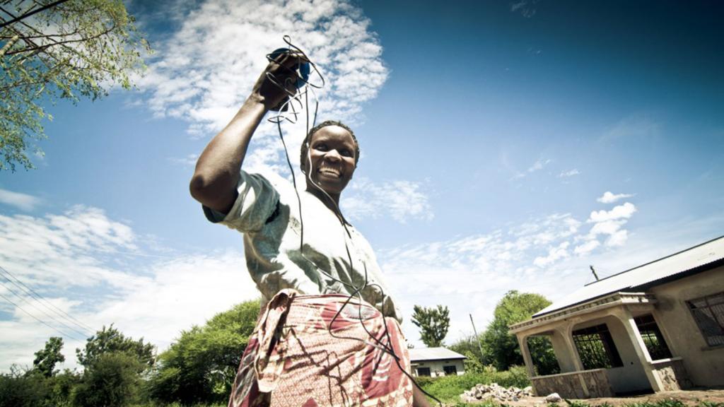 happy African woman with cords