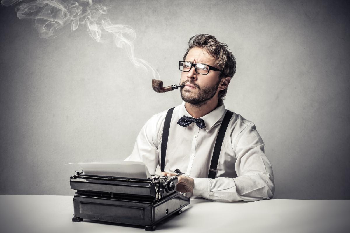 stereotypical journalist at typewriter