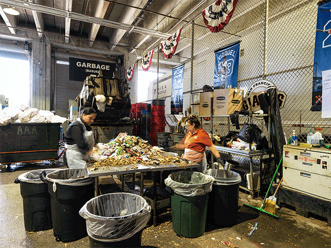 Sorting fans' trash at AT&T Park's recycling center.