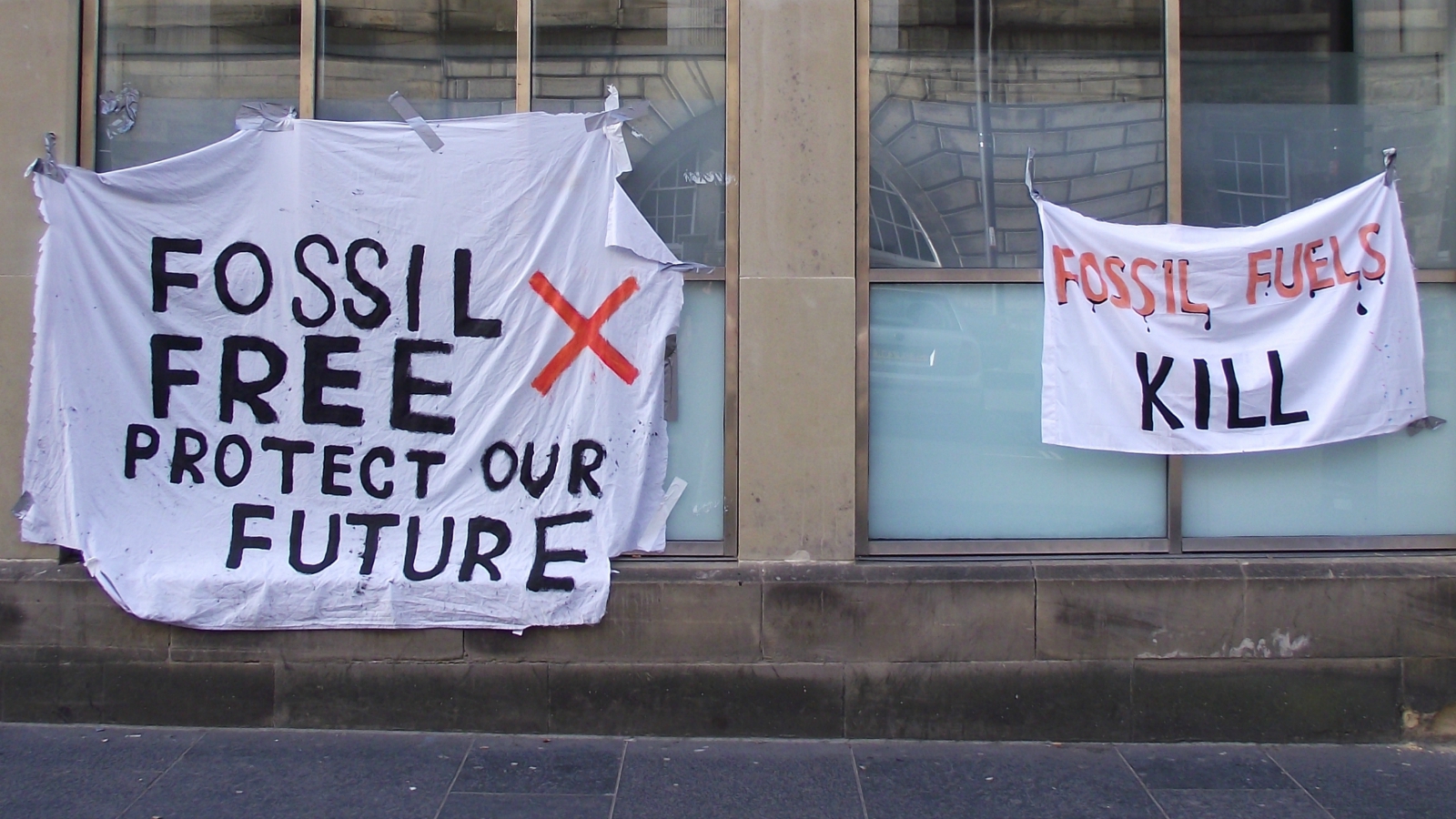 fossil fuel protest signs
