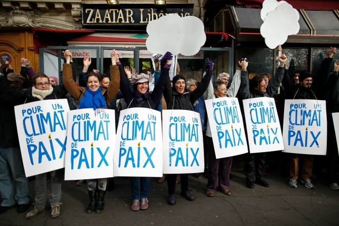 human chain with signs reading "For a Climate of Peace"