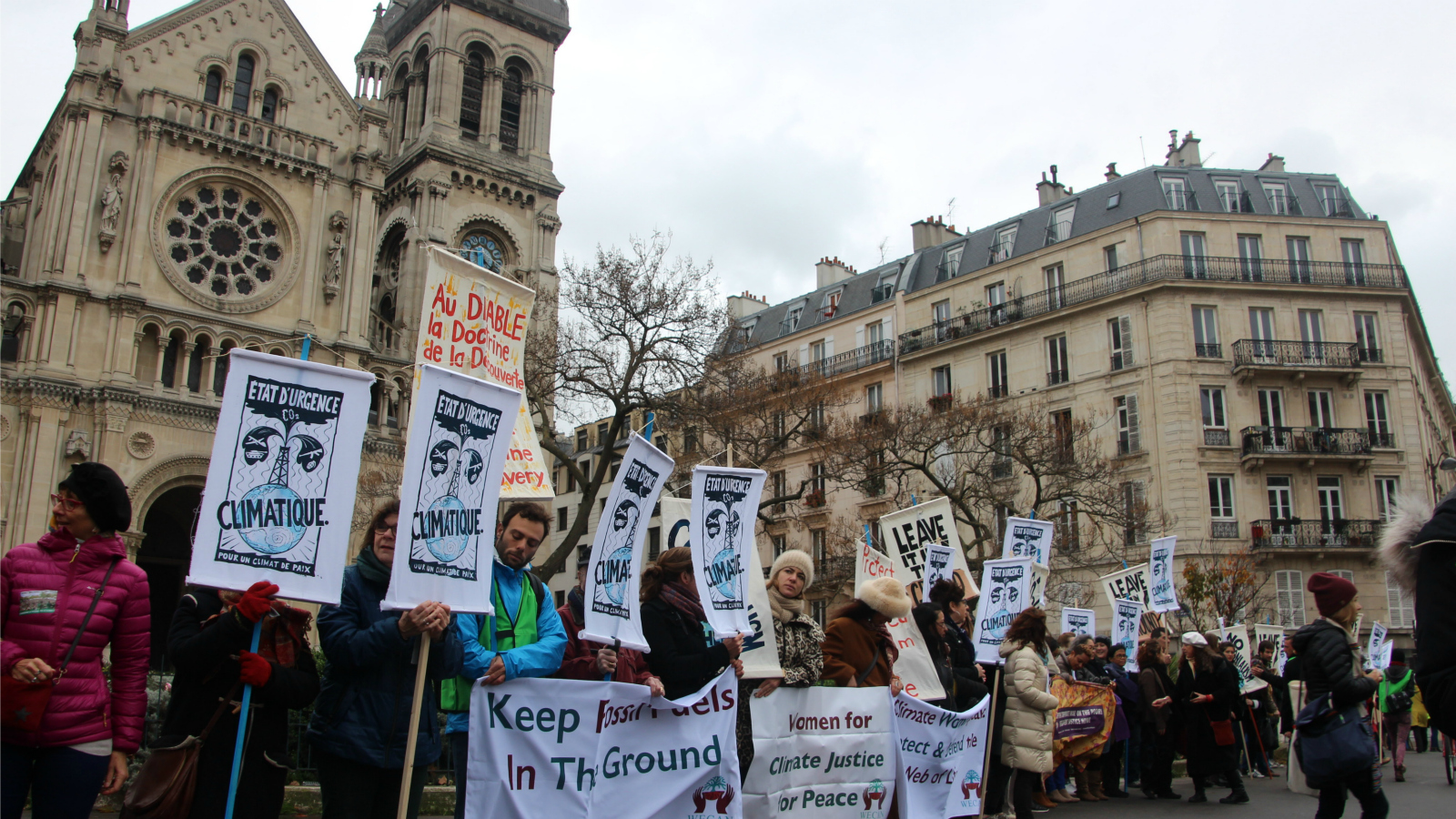 activists holding signs in Paris