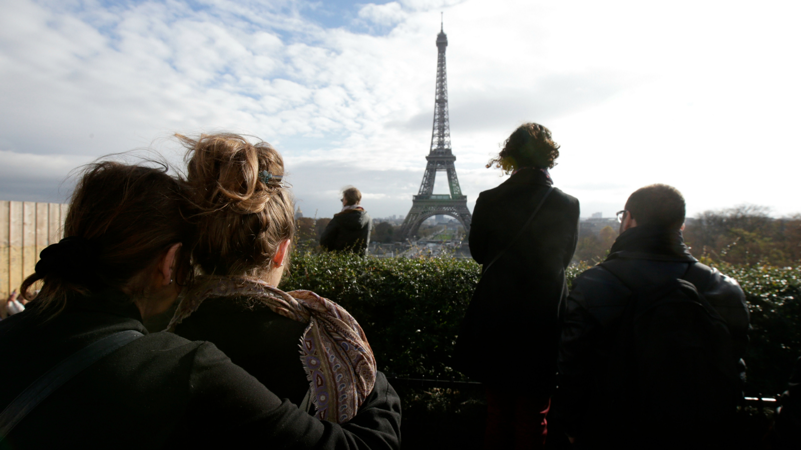 mourners in front of Eiffel Tower