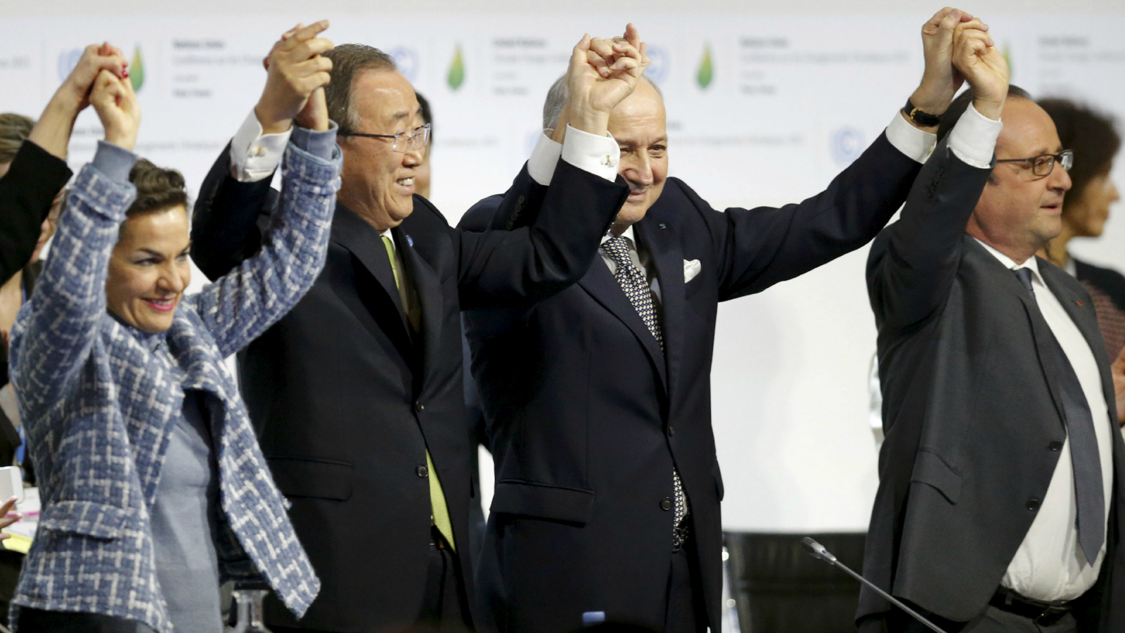 From L-R, Christiana Figueres, Executive Secretary of the UN Framework Convention on Climate Change, United Nations Secretary-General Ban Ki-moon, French Foreign Affairs Minister Laurent Fabius, President-designate of COP21 and French President Francois Hollande react during the final plenary session at the World Climate Change Conference 2015 (COP21) at Le Bourget, near Paris, France, December 12, 2015.