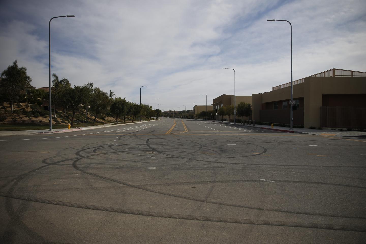 Tire skid marks cover an intersection between a housing development, left, and Porter Ranch Community School. Schools have been closed for weeks and at times the Porter Ranch is more of a ghost town then the thriving escape from Los Angeles it was billed as.