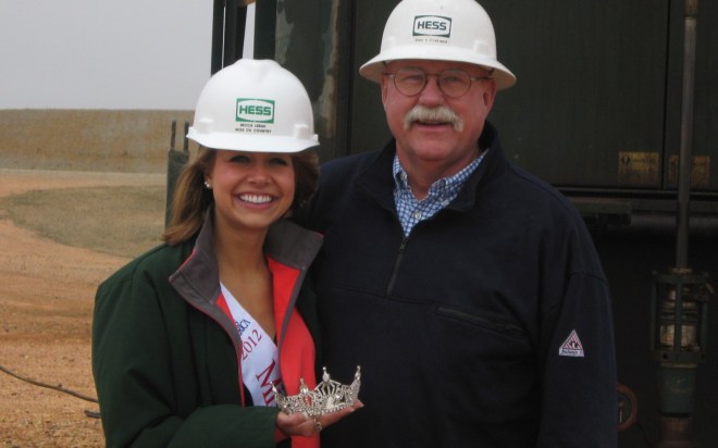 Rebecca Lebak, former Miss Oil Country, on a tour of the Hess oil field in Tioga, N.D.