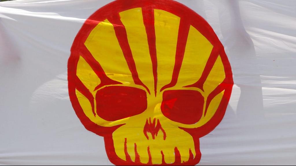 A member of the Indigenous Environmental Network demonstrates against the Shell oil company outside the South African Petroleum Refinery (SAPREF) in Durban November 30, 2011. The city is hosting the United Nations Framework Convention on Climate Change Conference of the Parties meeting (COP17).