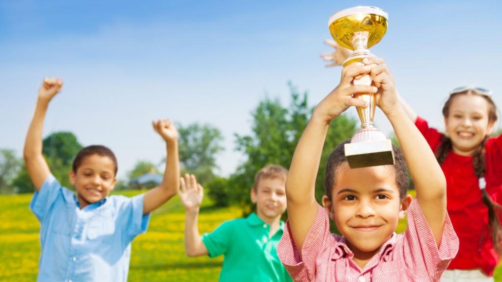Happy kids with a trophy.
