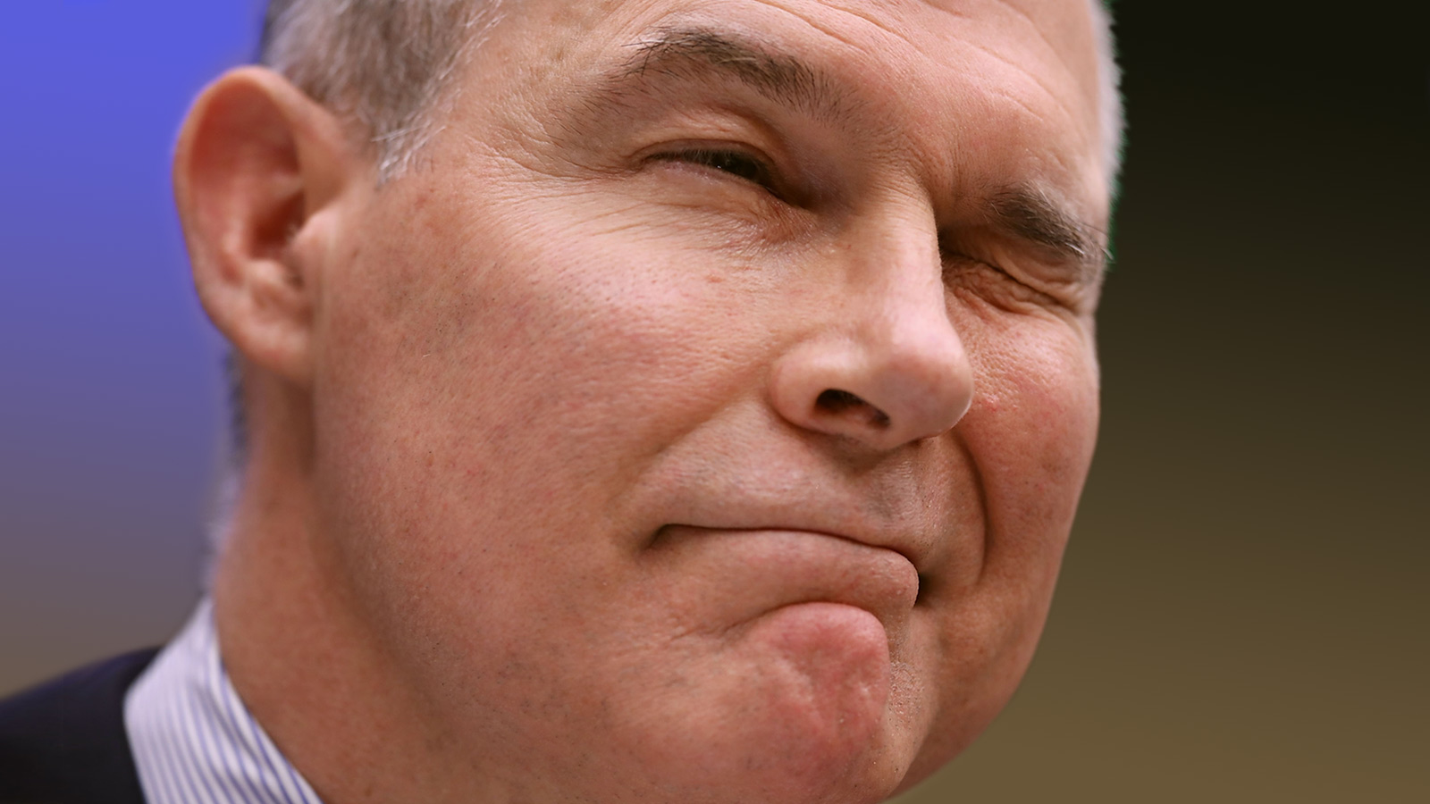 Former Environmental Protection Agency Administrator Scott Pruitt winks to lawmakers while testifying before the House Energy and Commerce Committee's Environment Subcommittee