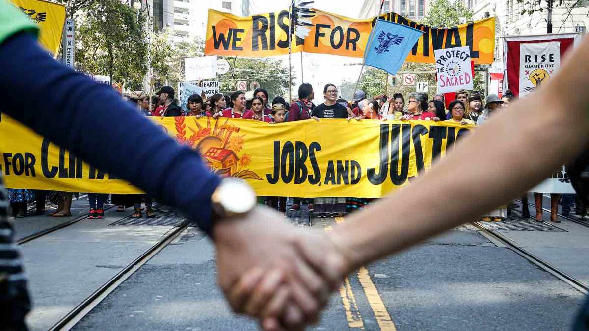 Crowds march up Market Street during the 'Rise For Climate' global action on September 8, 2018 in San Francisco, California.