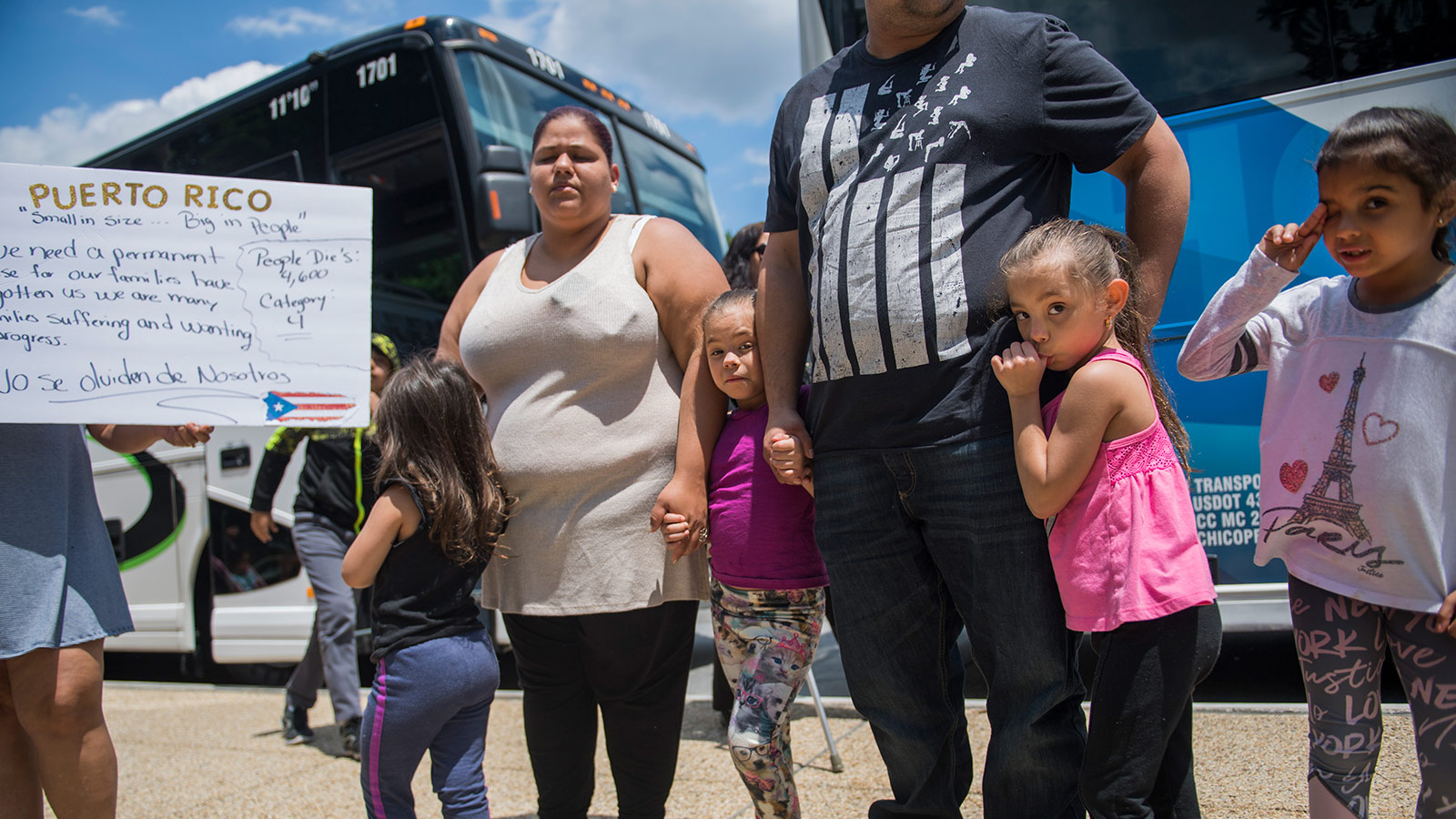 Puerto Ricans who were displaced by Hurricane Maria, arrive in buses from western Massachusetts on First St., NE, on June 6, 2018.