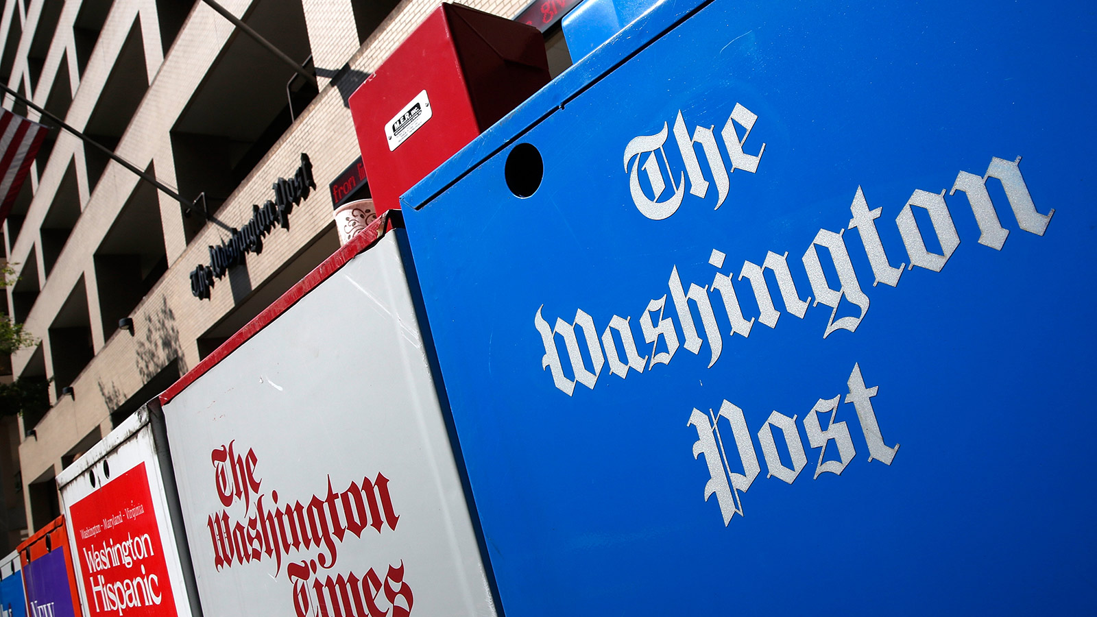 Newspaper boxes stand outside the Washington Post building