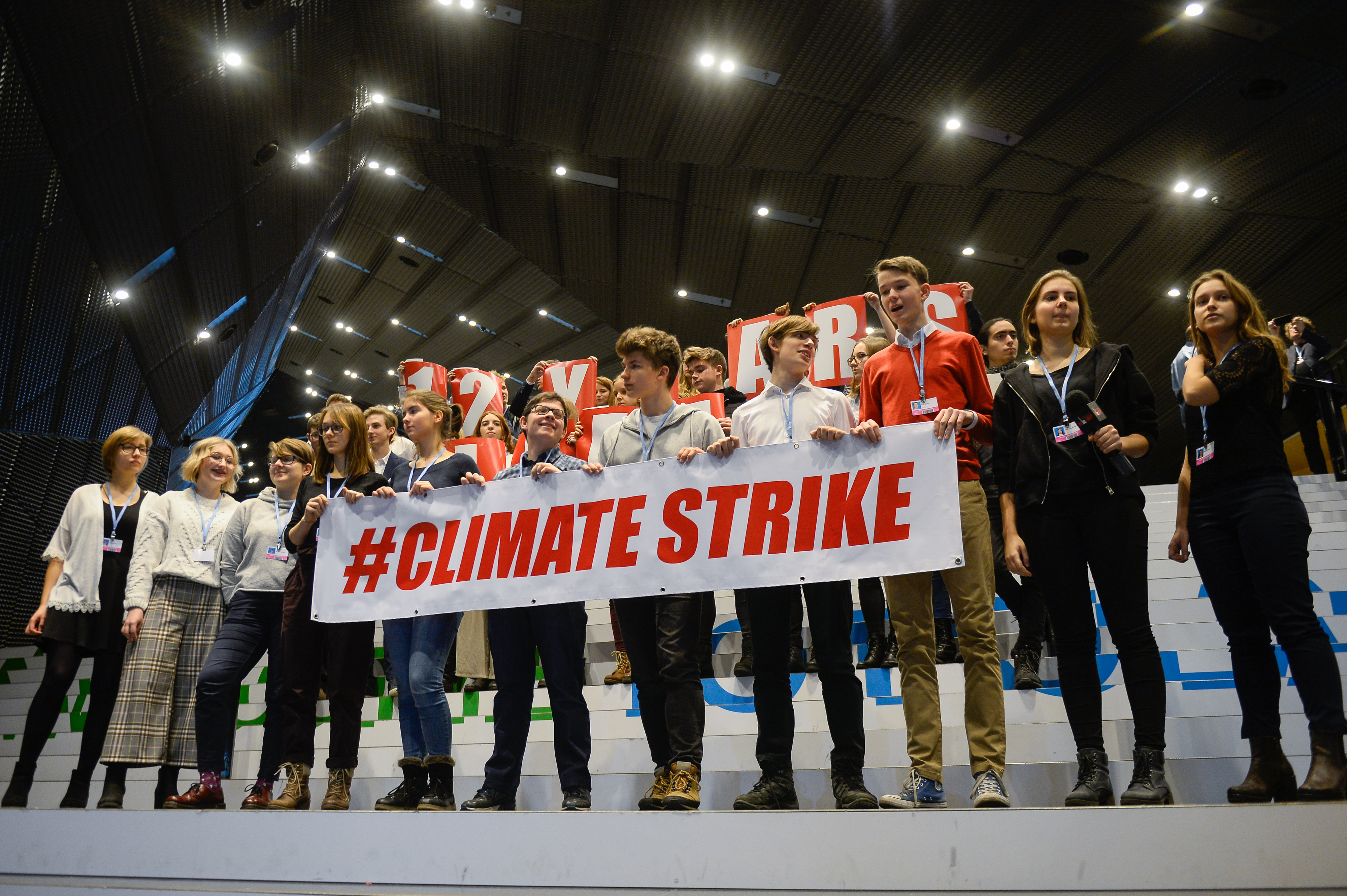 Polish students are seen holding a banner during a protest at the UN COP24 Climate Change conference, in solidarity with 15-year-old activist Greta Thunberg.
