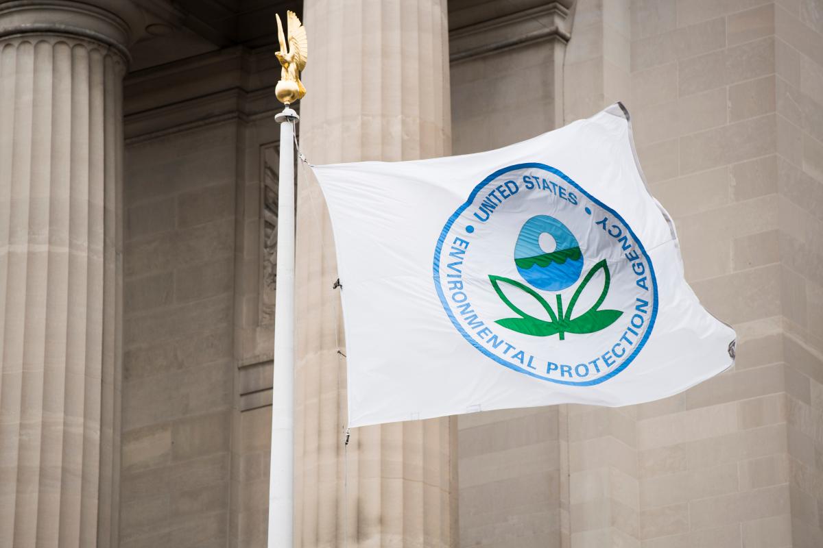 A flag with the EPA logo flies in front of the Environmental Protection Agency.