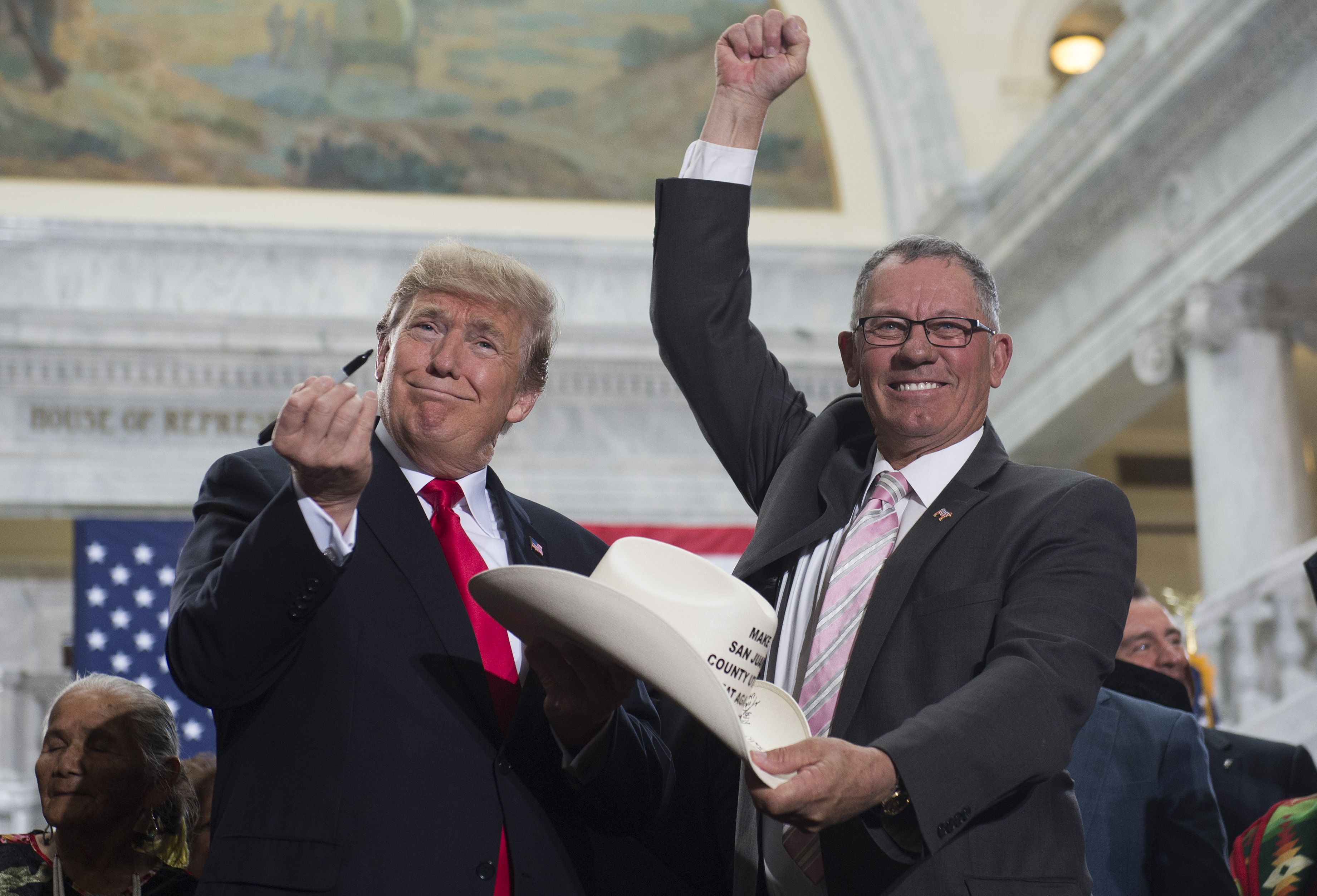 President Trump signs the hat of Bruce Adams, Chairman of the San Juan County Commission, following a Presidential Proclamation shrinking Bears Ears and Grand Staircase-Escalante national monuments.