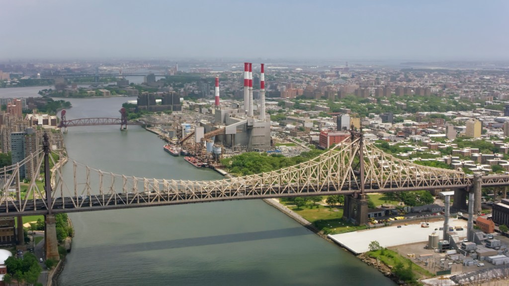 Aerial shot approaching the Ravenswood Generating Station in New York.