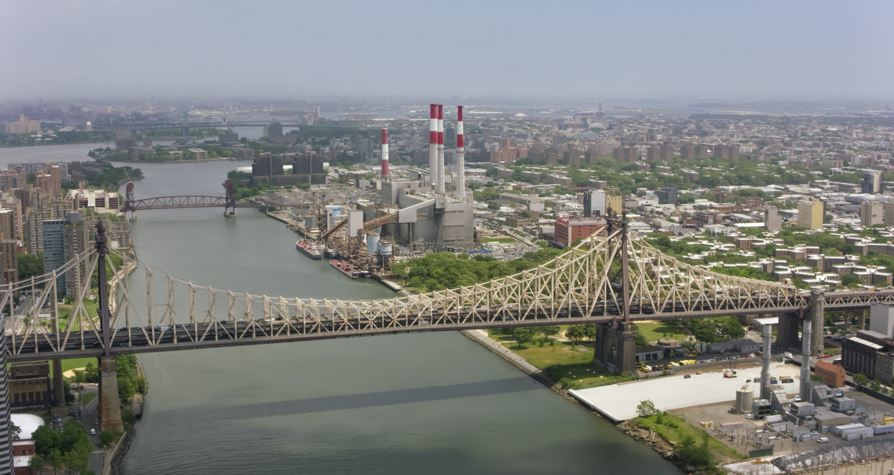 Aerial shot approaching the Ravenswood Generating Station in New York.