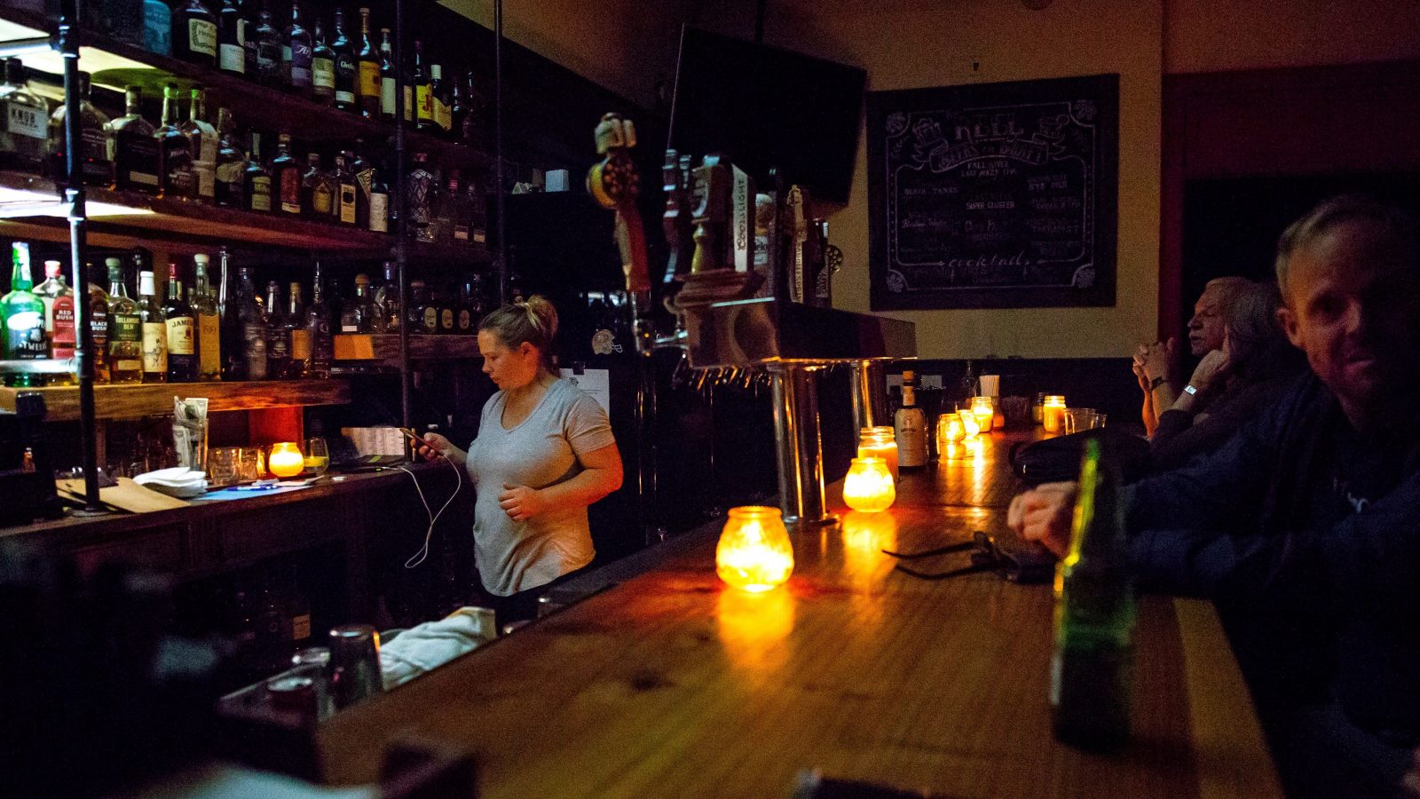 https://grist.org/wp-content/uploads/2019/10/candle-lit-bar-e1570732913540.jpg