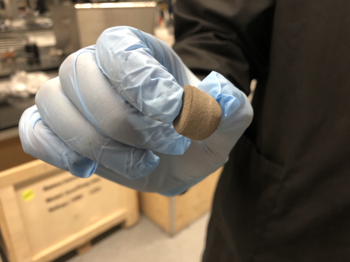 Scientist holds up a "precursor" or the bulk material used to make nano materials